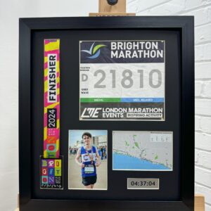 Brighton Marathon medal frame with bib, photo, and map.